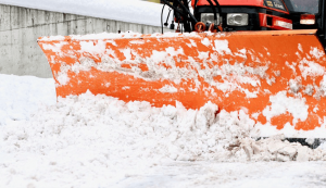 Snow plow moving snow | Commercial snow services by Above & Beyond Lawn & Landscaping